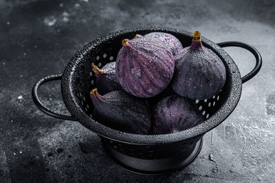 High angle view of wet purple flowers in bowl