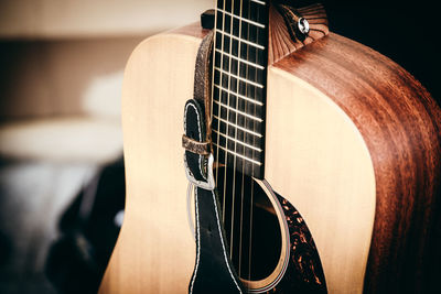 Close-up of hand playing guitar