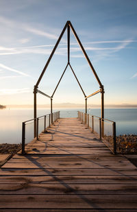 Pier over sea against sky