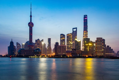 View of skyscrapers lit up at night