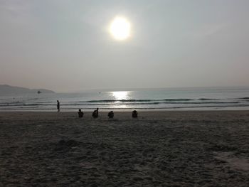 Scenic view of beach against sky during sunset