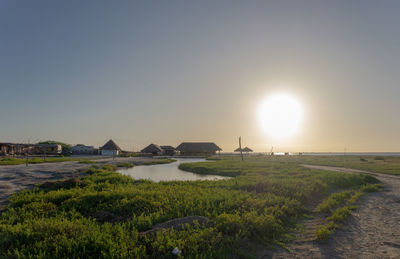 Scenic view of sea against clear sky during sunset