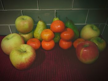 Tomatoes and fruits in plate