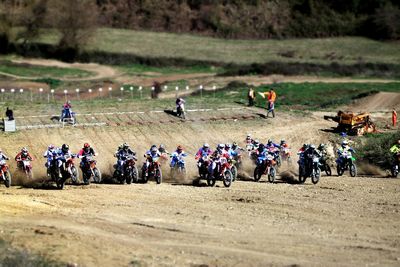 Bikers racing on field