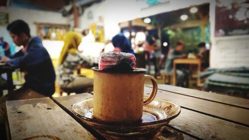 Coffee cup on table in cafe