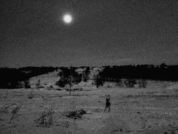 Scenic view of silhouette landscape against sky at night