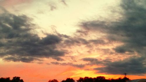 Low angle view of cloudy sky at sunset