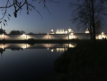 Scenic view of river against sky at night