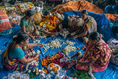 High angle view of people sitting in traditional clothing