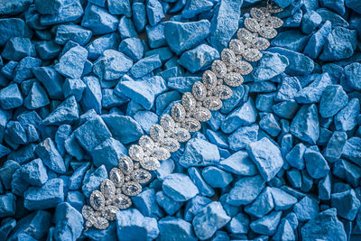 Full frame shot of jewelry on stones