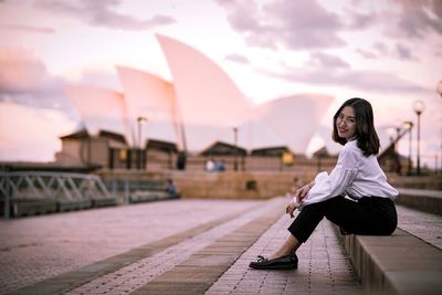 Portrait of woman sitting outdoors