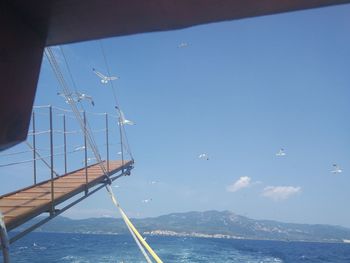 Sailboat in sea against sky