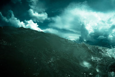 Scenic view of sea against storm clouds