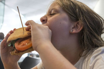 Close-up of girl eating food