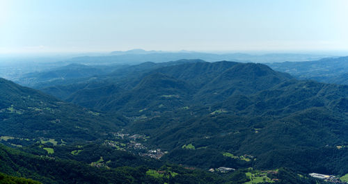 High angle view of valley and mountains against sky