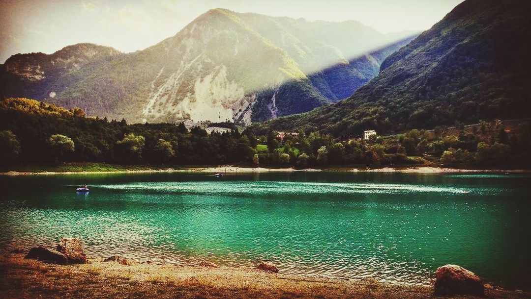 SCENIC VIEW OF LAKE AGAINST MOUNTAIN RANGE