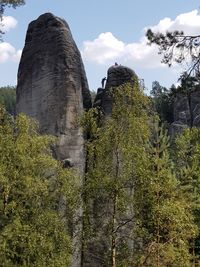 Low angle view of rock formation against sky