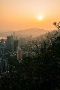 Cityscape against sky during sunset