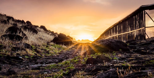 Panoramic view of rocks against sky during sunset