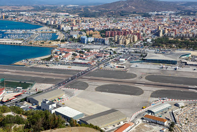 High angle view of road by buildings in city