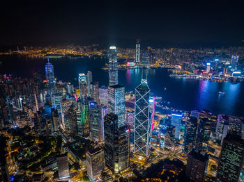 High angle view of illuminated buildings in city at night