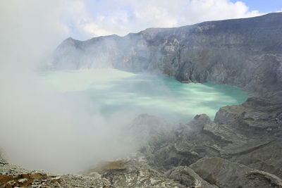 Smoke emitting from volcanic mountain