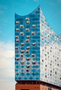 Low angle view of building against blue sky