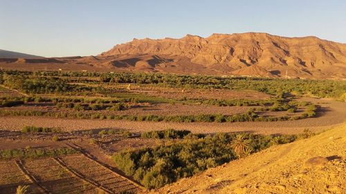 Scenic view of desert against clear sky