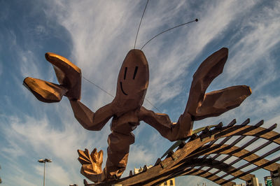 Low angle view of statue against sky