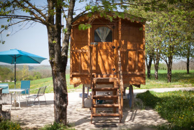 Built structure on land against trees