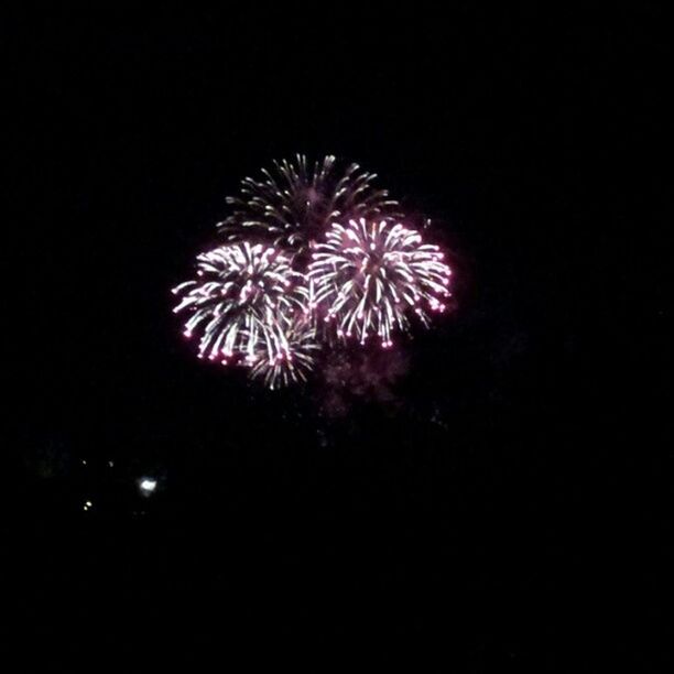 night, celebration, firework display, illuminated, exploding, arts culture and entertainment, firework - man made object, low angle view, glowing, event, long exposure, sparks, motion, sky, entertainment, multi colored, celebration event, firework, clear sky, copy space