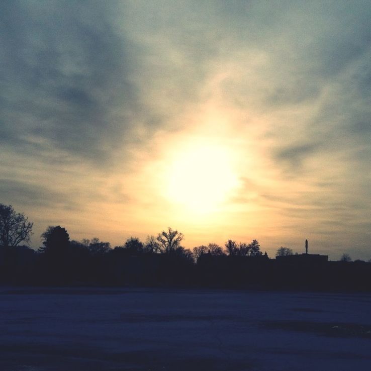 sunset, silhouette, sky, tranquil scene, scenics, tranquility, cloud - sky, beauty in nature, tree, orange color, landscape, nature, sun, idyllic, field, cloudy, cloud, outdoors, weather, no people