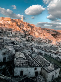 Aerial view of old town against cloudy sky