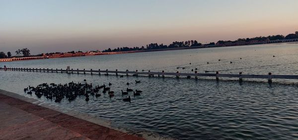 Scenic view of sea against clear sky during sunset