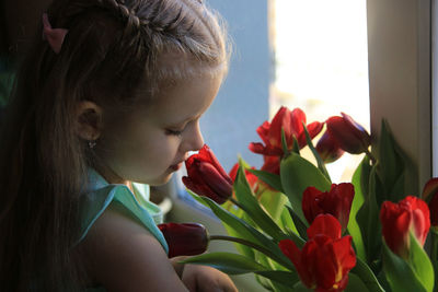 Close-up of girl with pink flowers