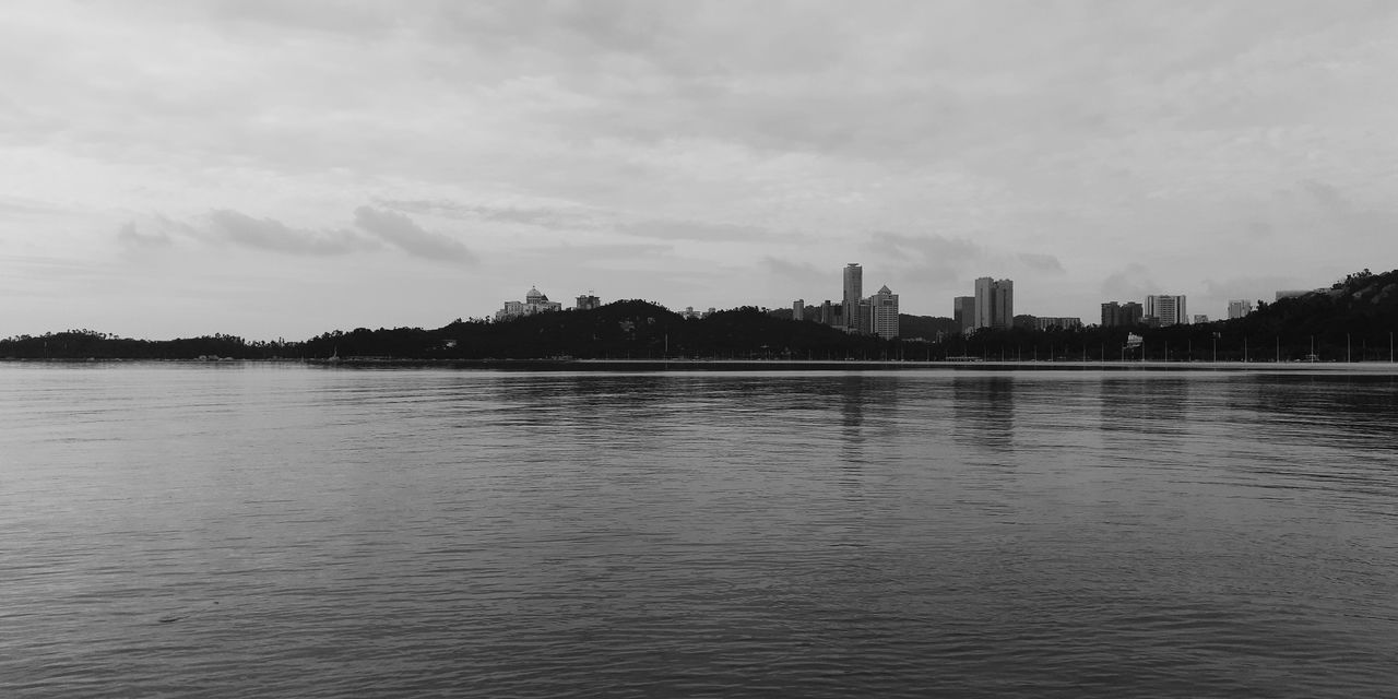 water, sky, waterfront, cloud - sky, architecture, nature, built structure, no people, building exterior, city, lake, landscape, beauty in nature, tranquility, scenics - nature, tranquil scene, outdoors, urban skyline, skyscraper