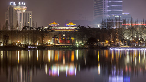 Illuminated buildings in city at night