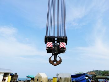 Low angle view of amusement park ride against sky