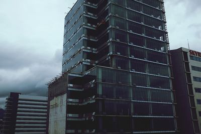 Low angle view of modern building against sky