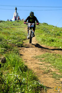 Man riding bicycle on mountain