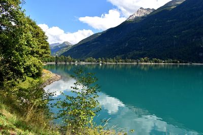 Scenic view of lake and mountains against sky