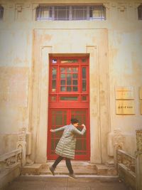 Woman in front of door