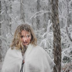 Portrait of young woman in snow