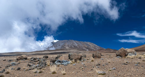 Scenic view of arid landscape against sky