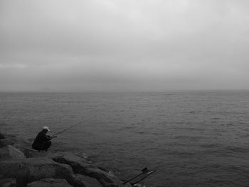 Scenic view of sea against cloudy sky