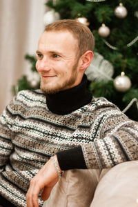 Portrait of young man looking away