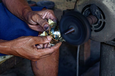Cropped hand of man washing hands