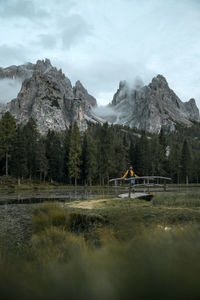 Scenic view of lake and mountains against sky