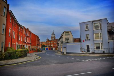 View of road along buildings