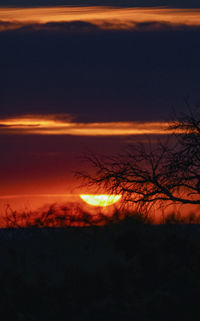 Scenic view of silhouette landscape against romantic sky at sunset